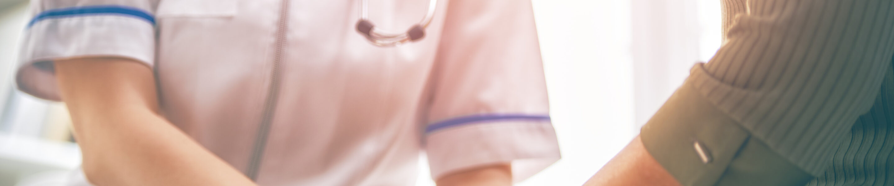 Female patient listening to doctor in medical office.