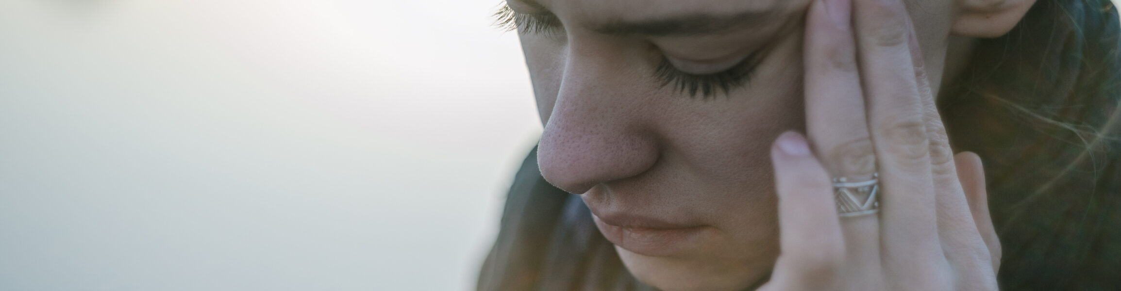 Young woman with sinus pressure pain. Depressing state concept