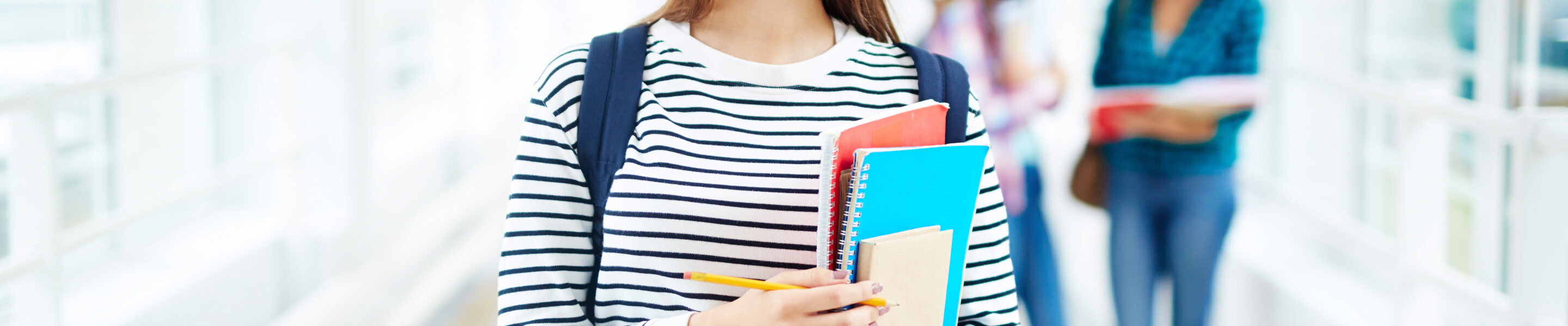 Portrait of female college student smiling at camera