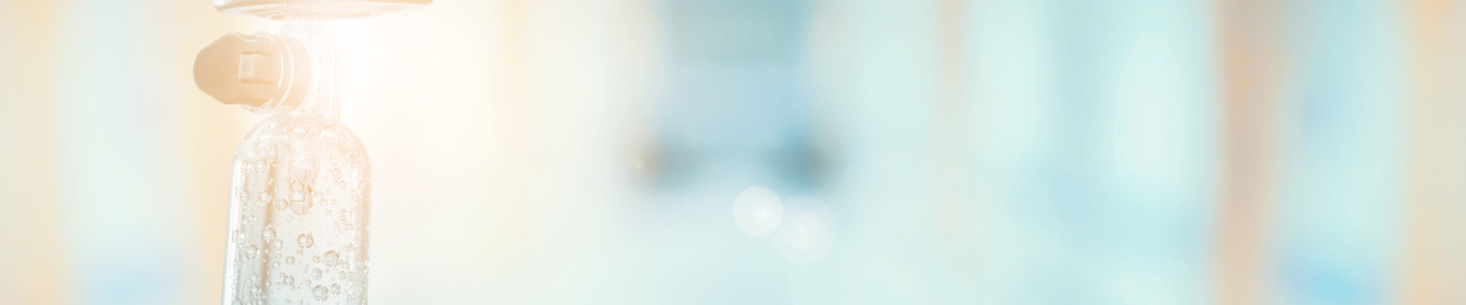 Medical drip with hospital blurred background