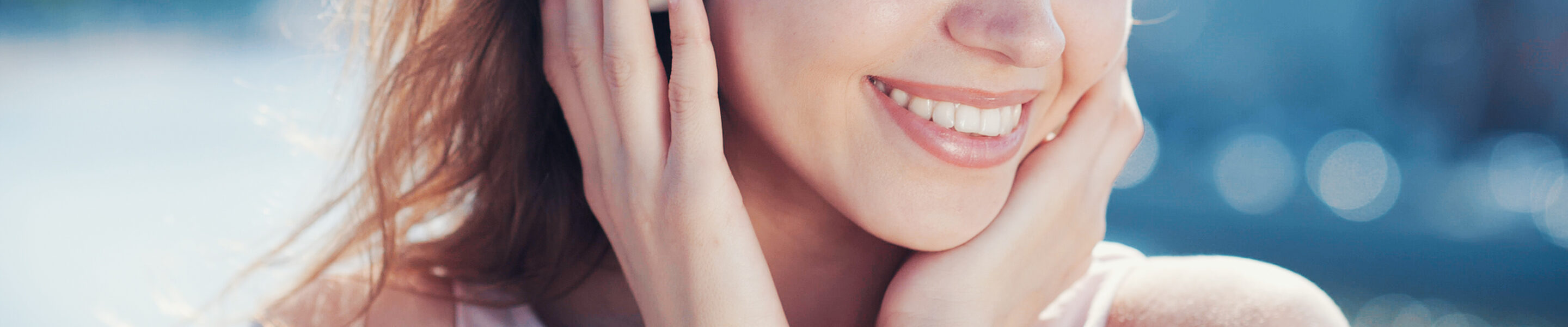 Smiling girl listen to music with headphones outdoors