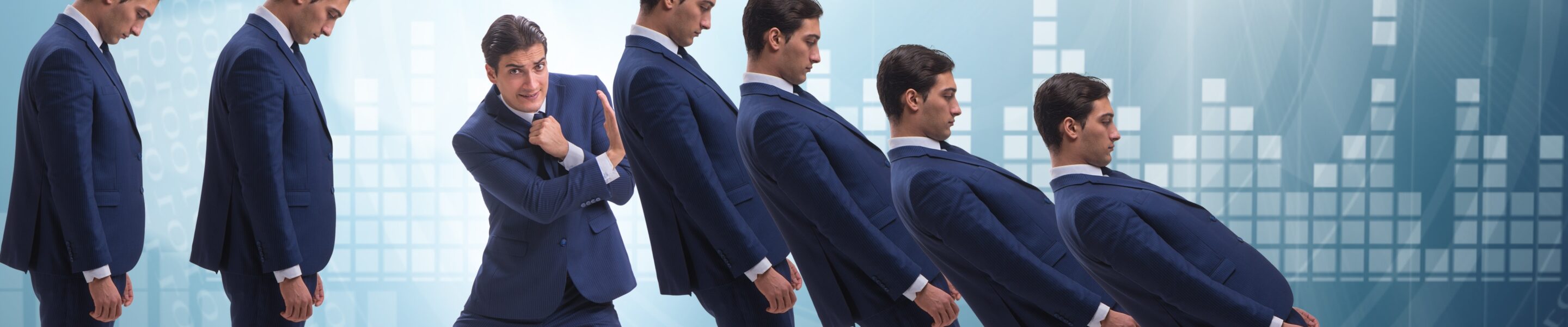 Businessman in domino effect business concept
