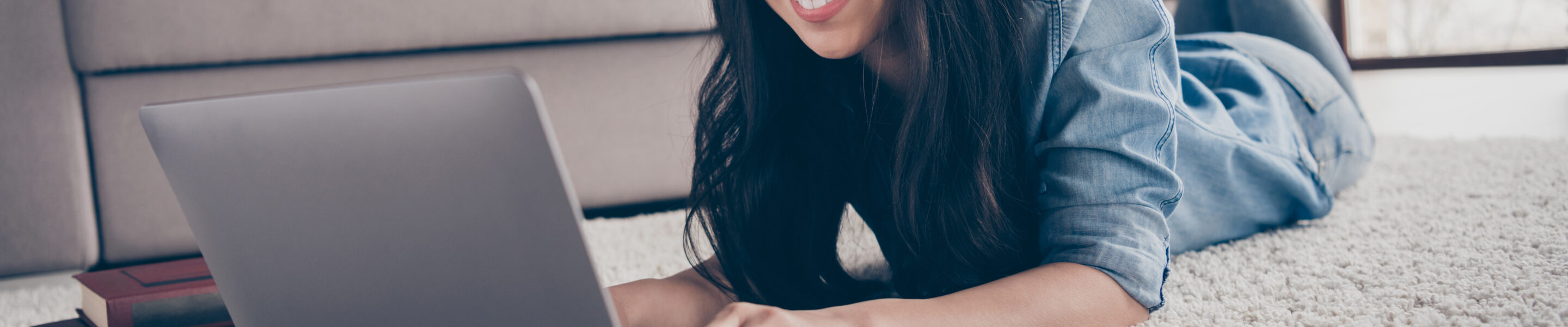 Close-up portrait of her she nice attractive lovely intellectual cheerful girl lying on carpet using laptop, studying course task lesson it project start-up in modern loft industrial house apartment