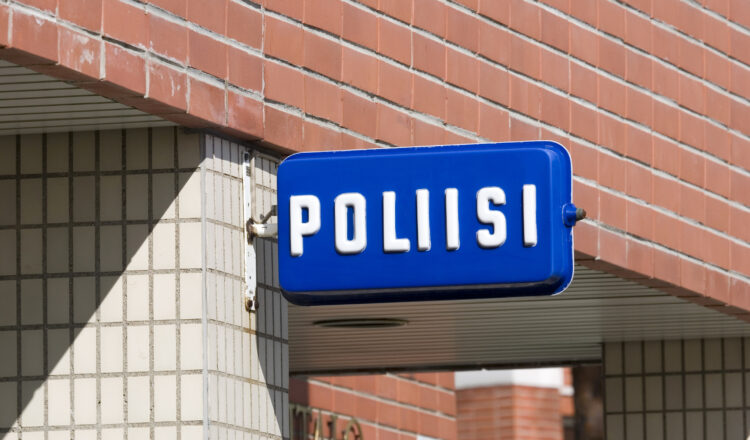 Finnish police sign on building wall, Finland Europe