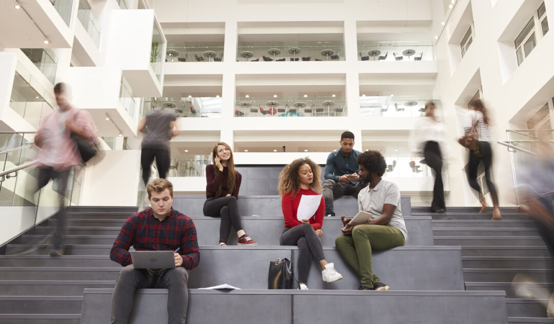 Interior Of Busy University Campus Building With Students